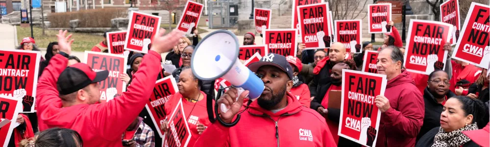 cwa members wearing red clothing rally for a fair contract